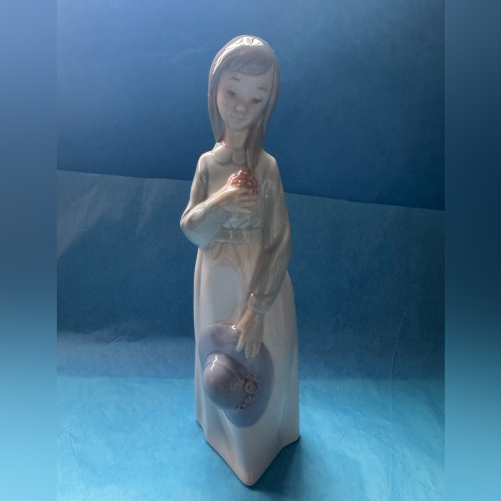 Elegant Ceramic Figurine in Blue and White Girl Holding A Hat Nao by Lladro